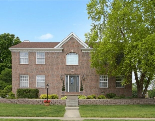 a front view of a house with a yard