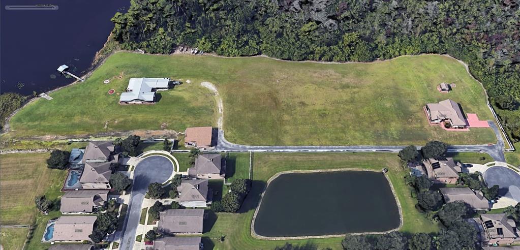 an aerial view of a house with outdoor space