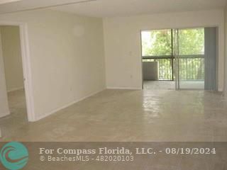 a view of an empty room and window