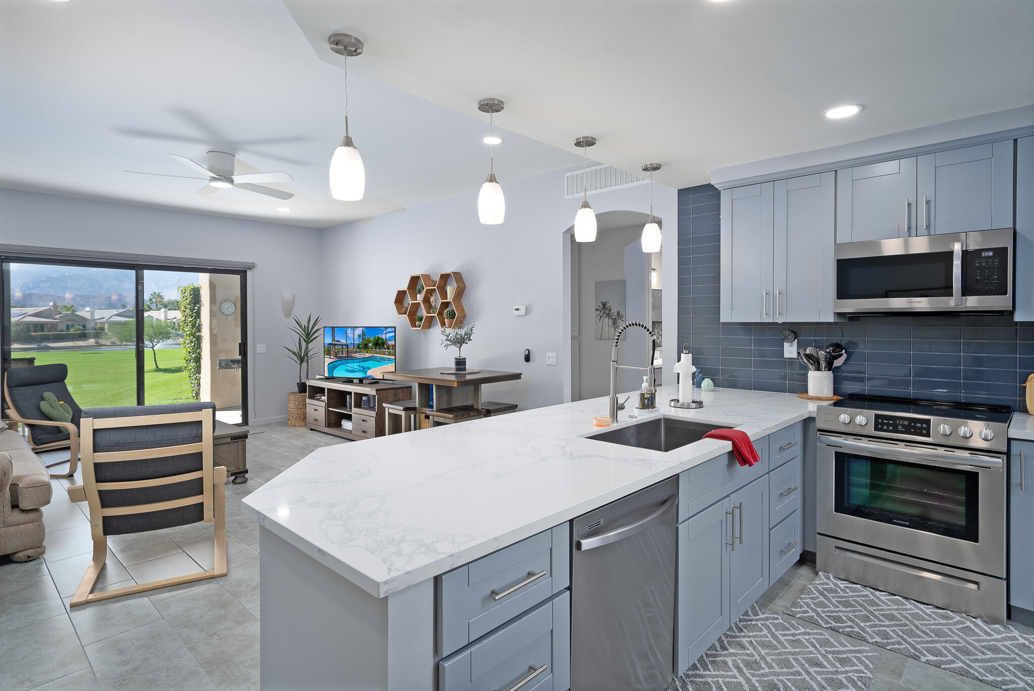 a kitchen with a stove a sink and a refrigerator