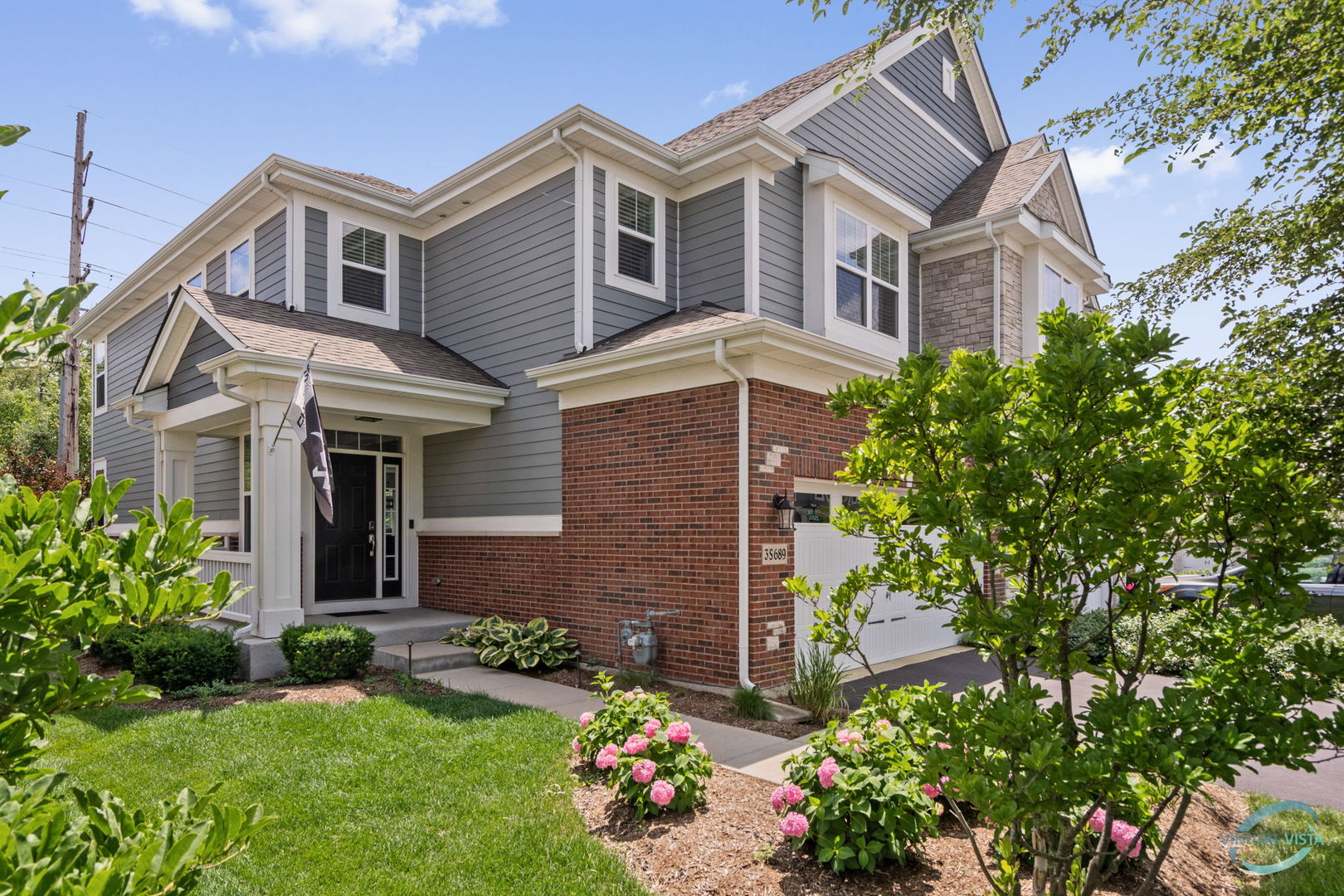 front view of a house with a yard