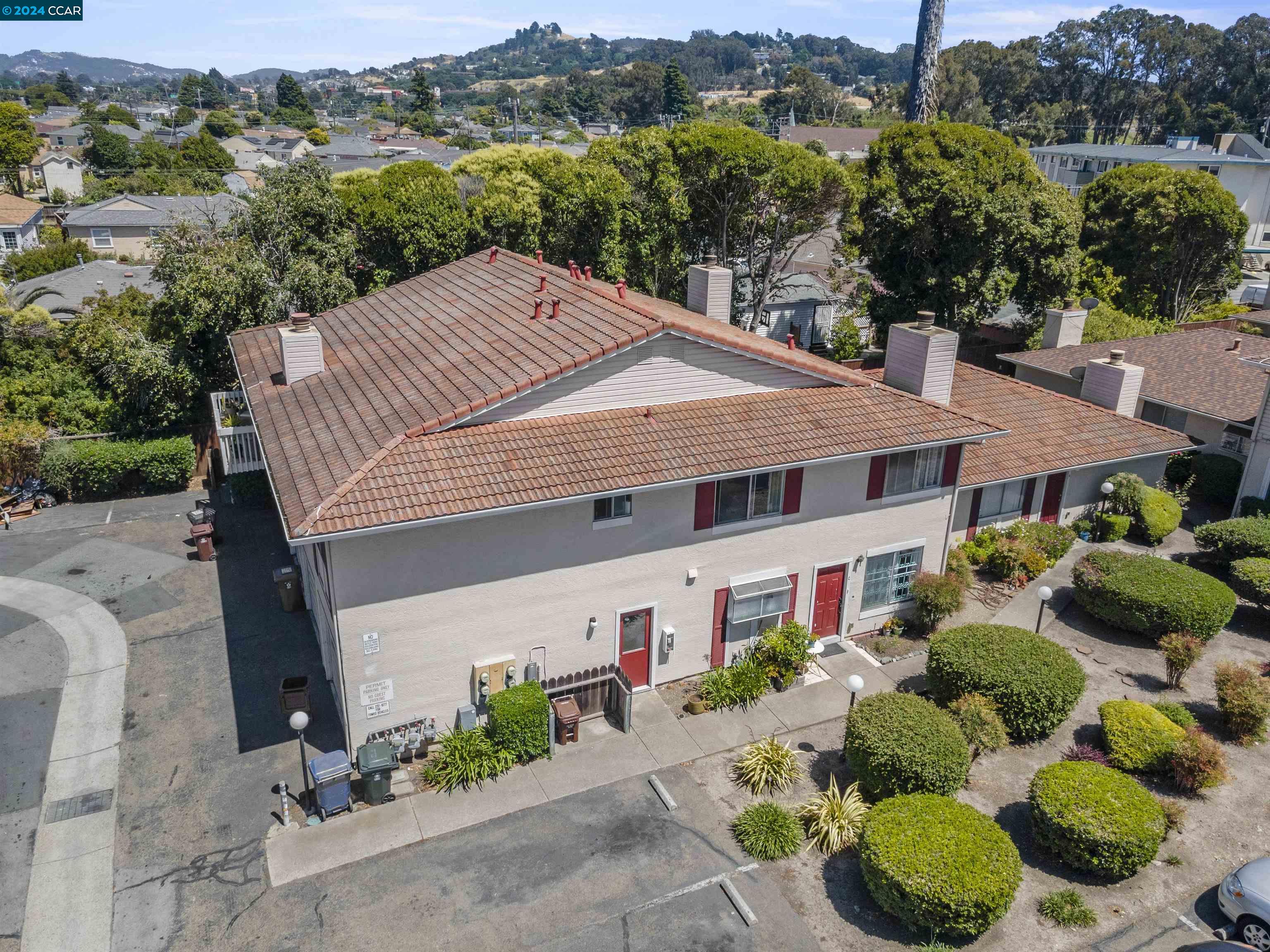 an aerial view of a house with a yard and outdoor seating