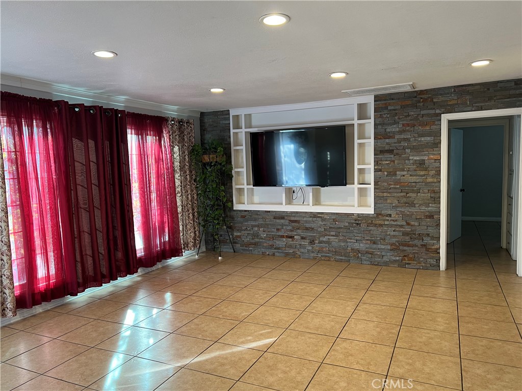 a view of a livingroom with a projector and furniture