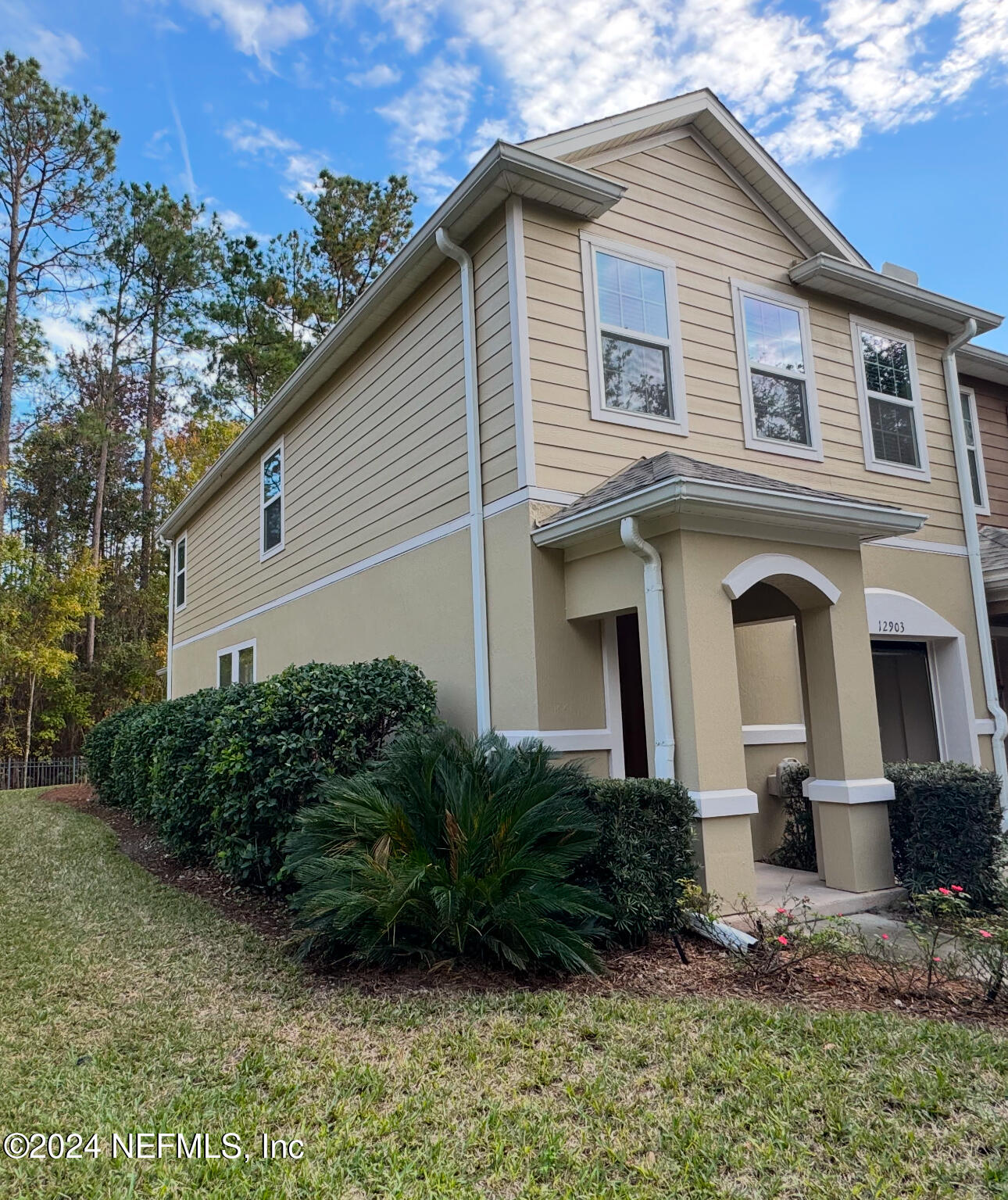 a front view of a house with a yard