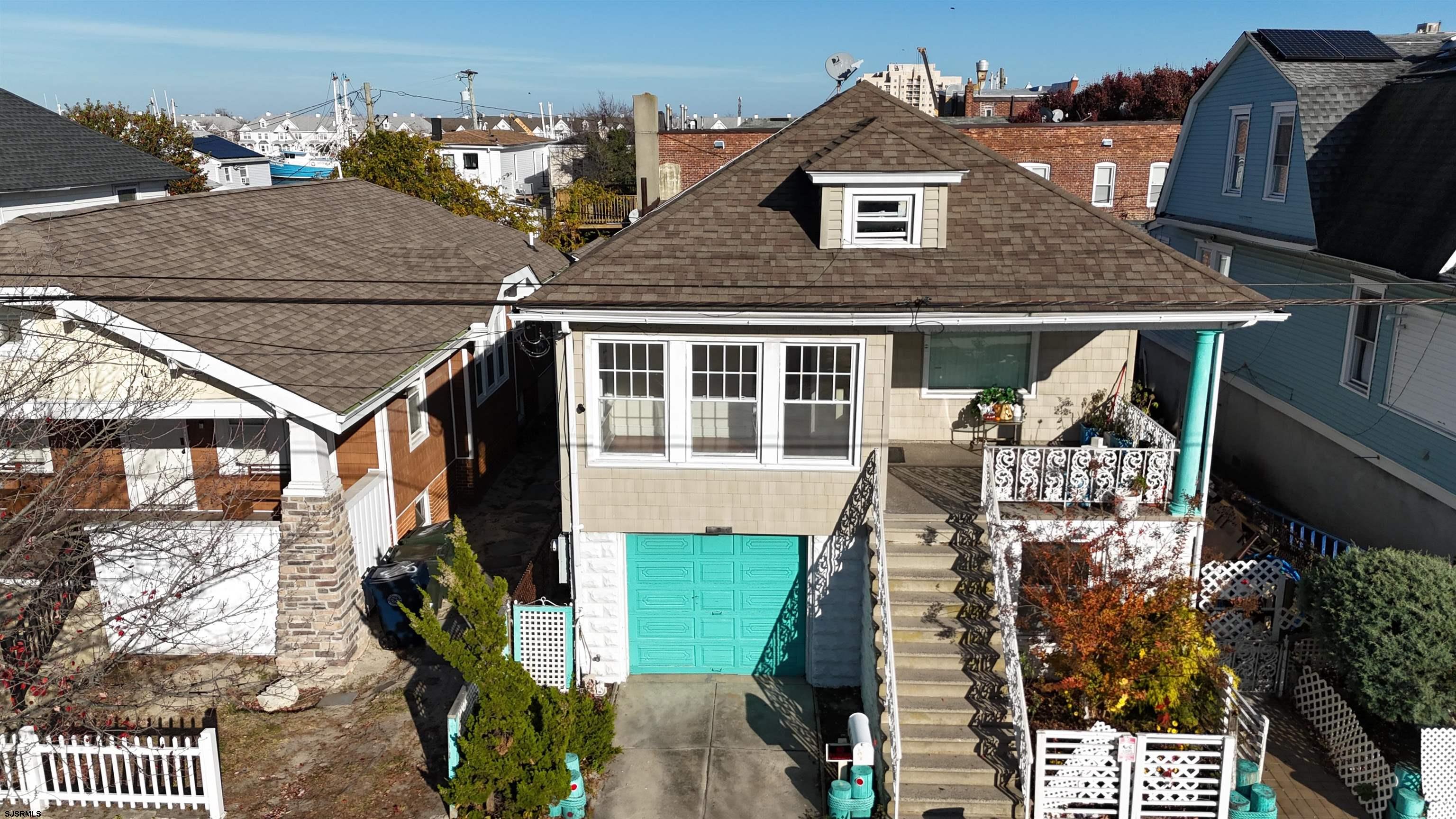 an aerial view of a house with table and chairs