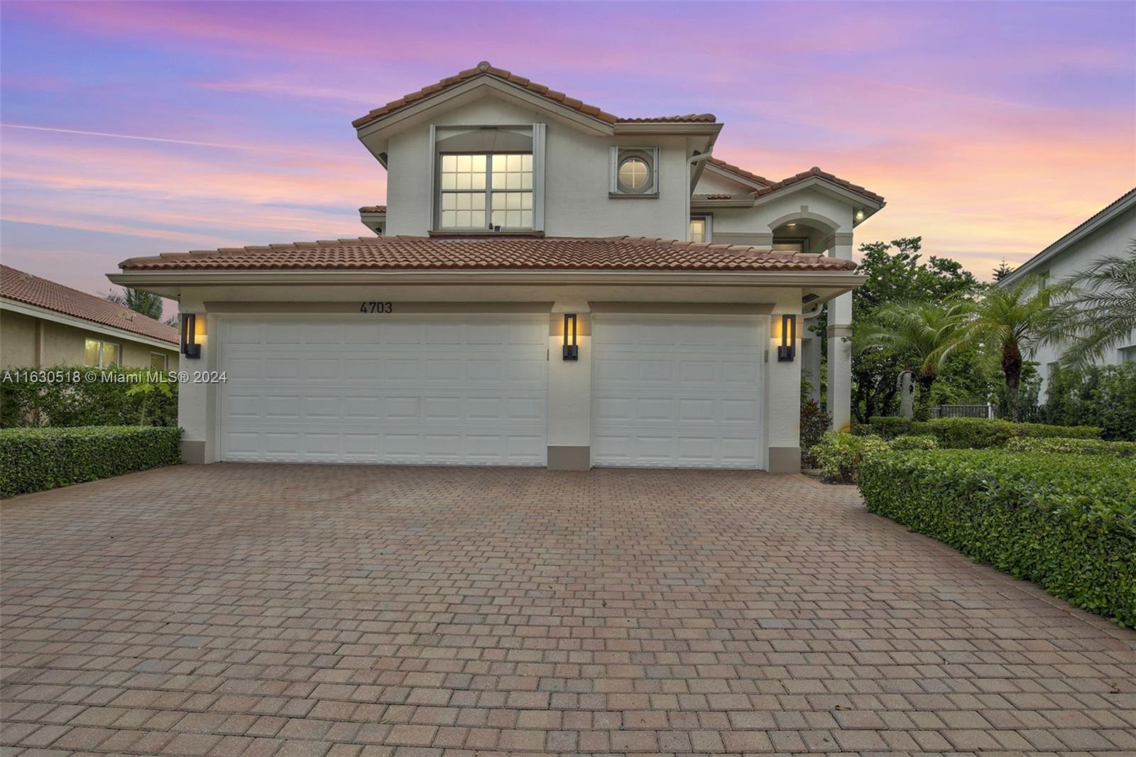 a view of a house with a yard and garage