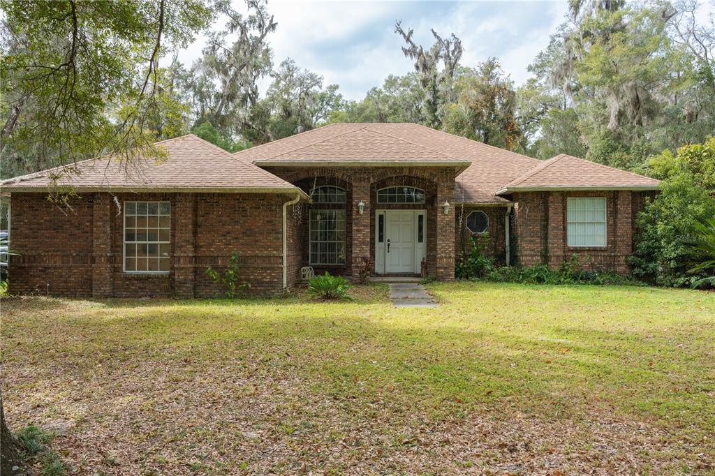 a front view of a house with a yard