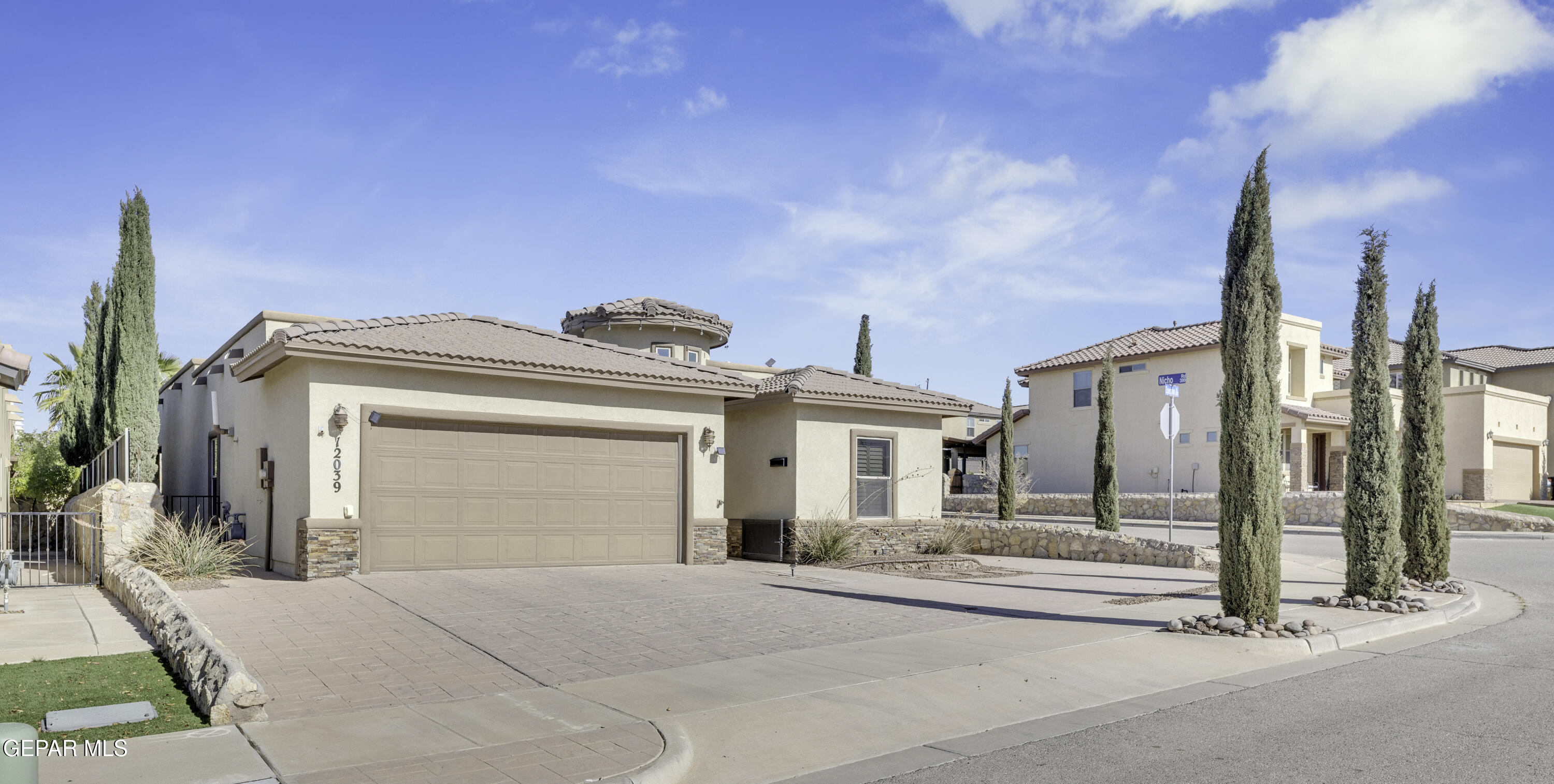 a front view of a house with a garage