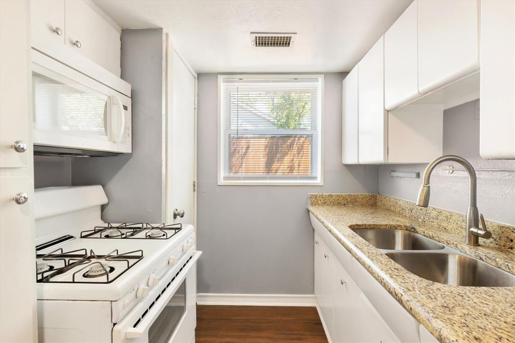 a kitchen with a stove and a sink