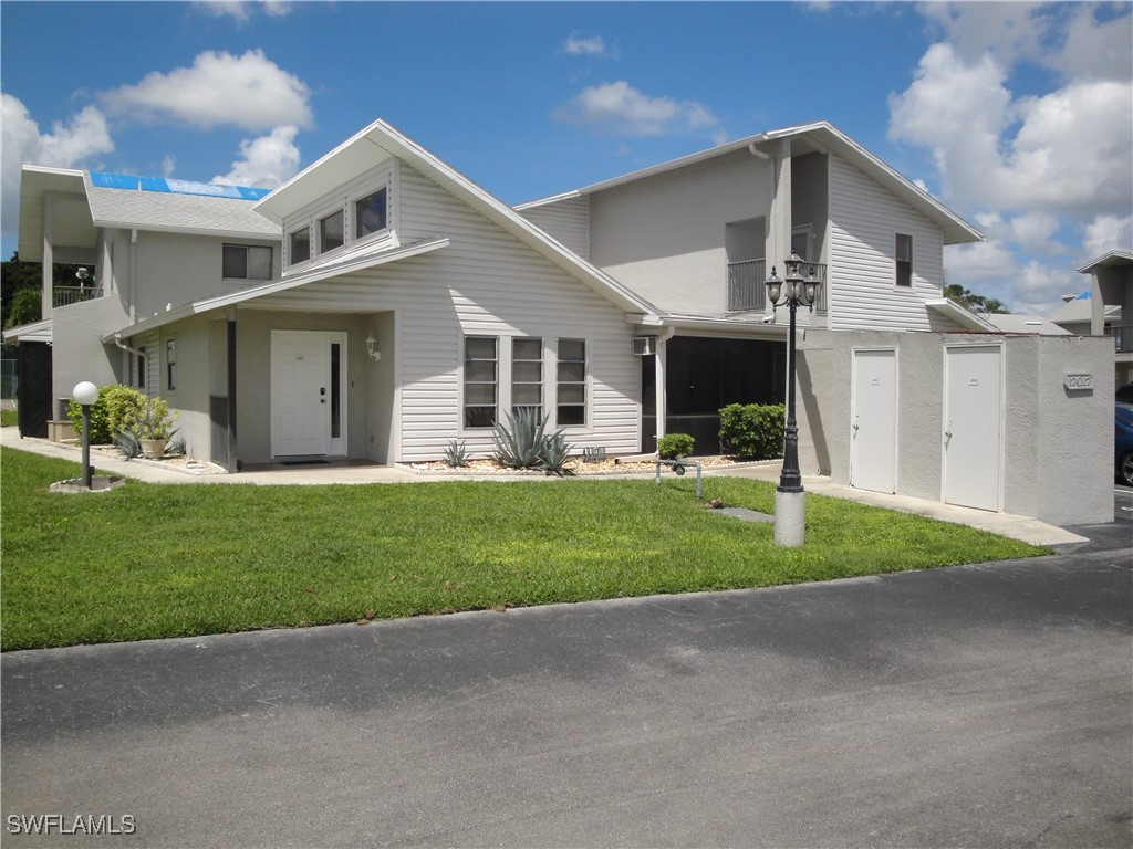 a front view of house with yard and green space