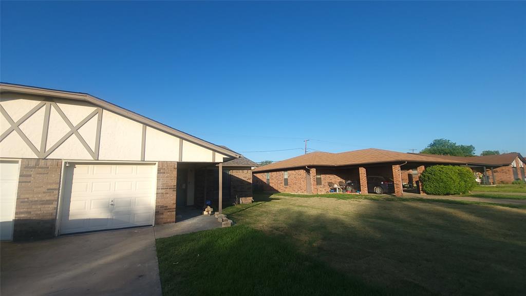 View of yard featuring a garage