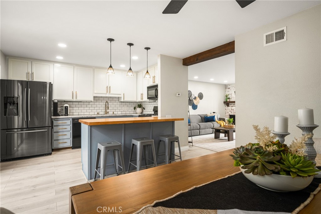 Updated kitchen with large dining area and bar seating