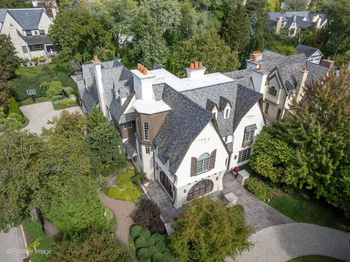 an aerial view of multiple houses with yard