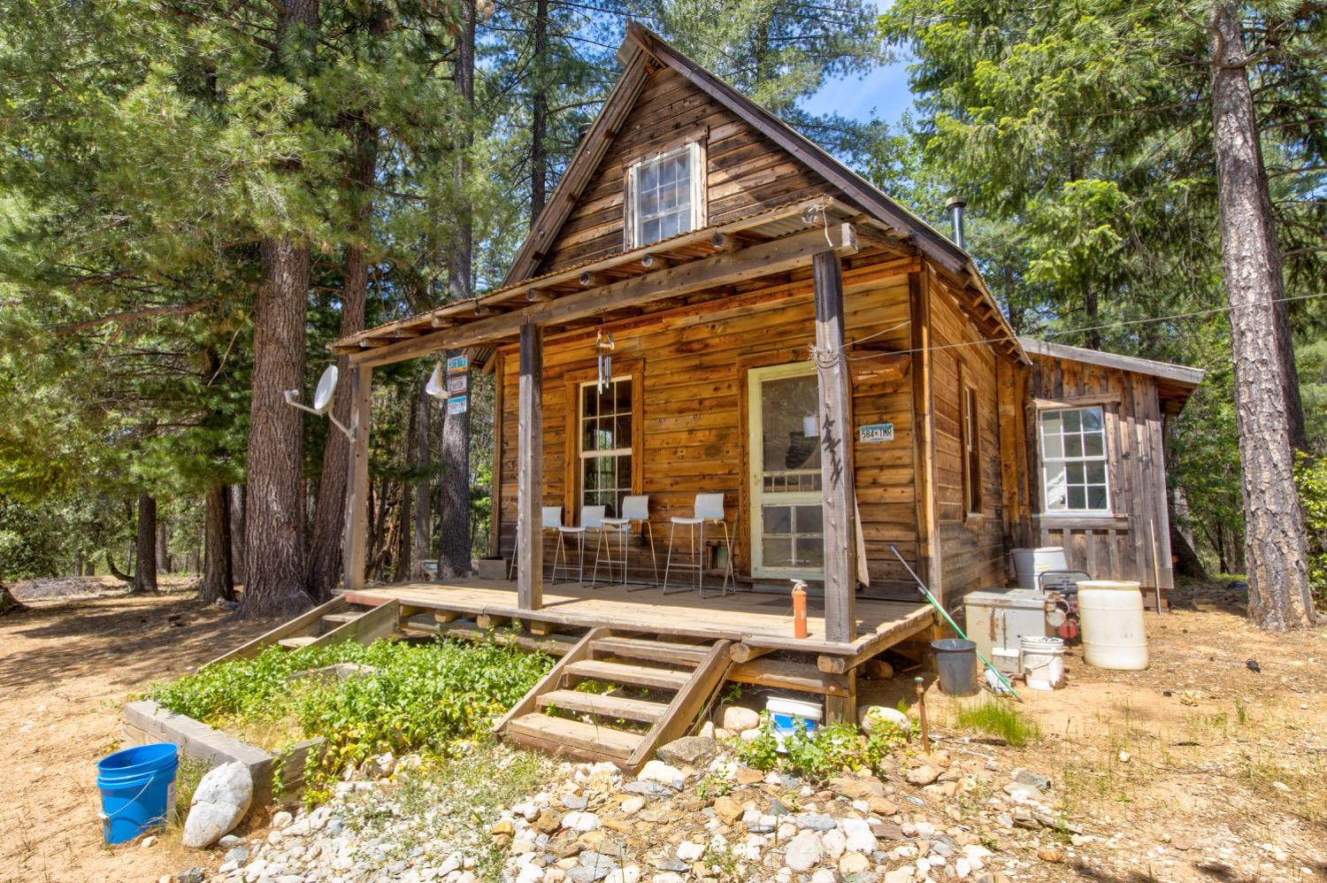 a view of a house with backyard outdoor seating area