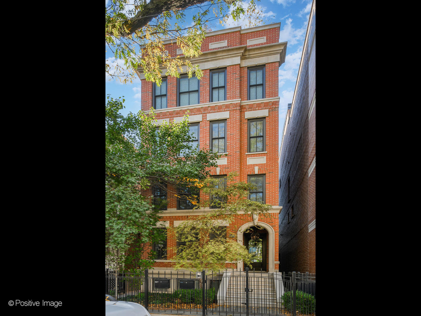 a view of a brick house with a large windows