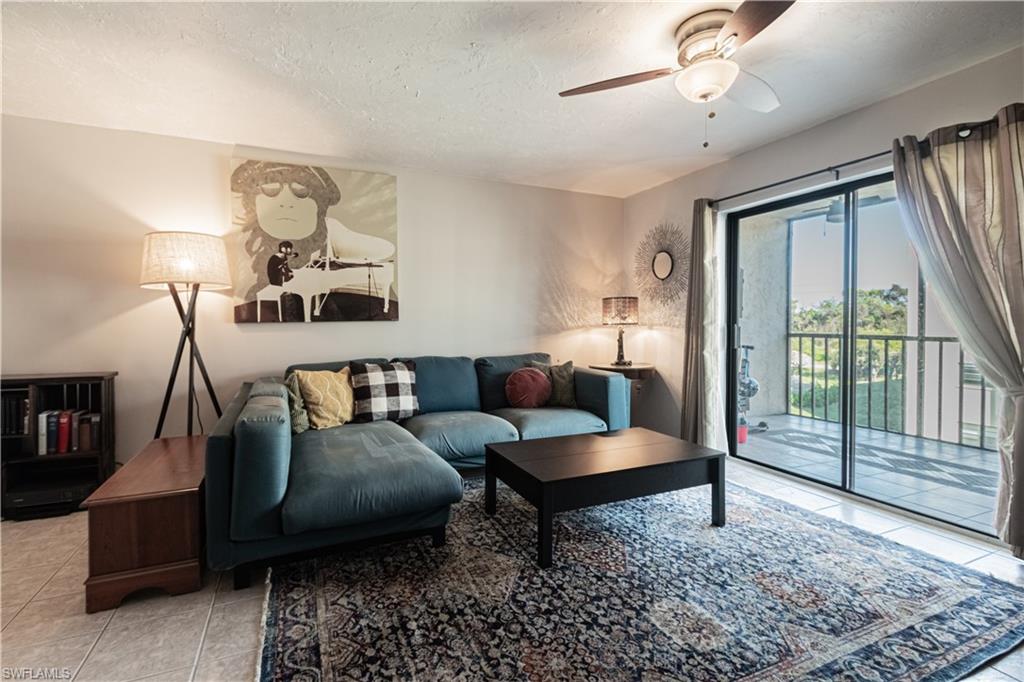 a living room with furniture and a rug