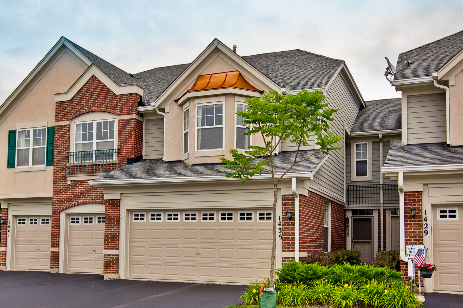 a front view of a house with a garage