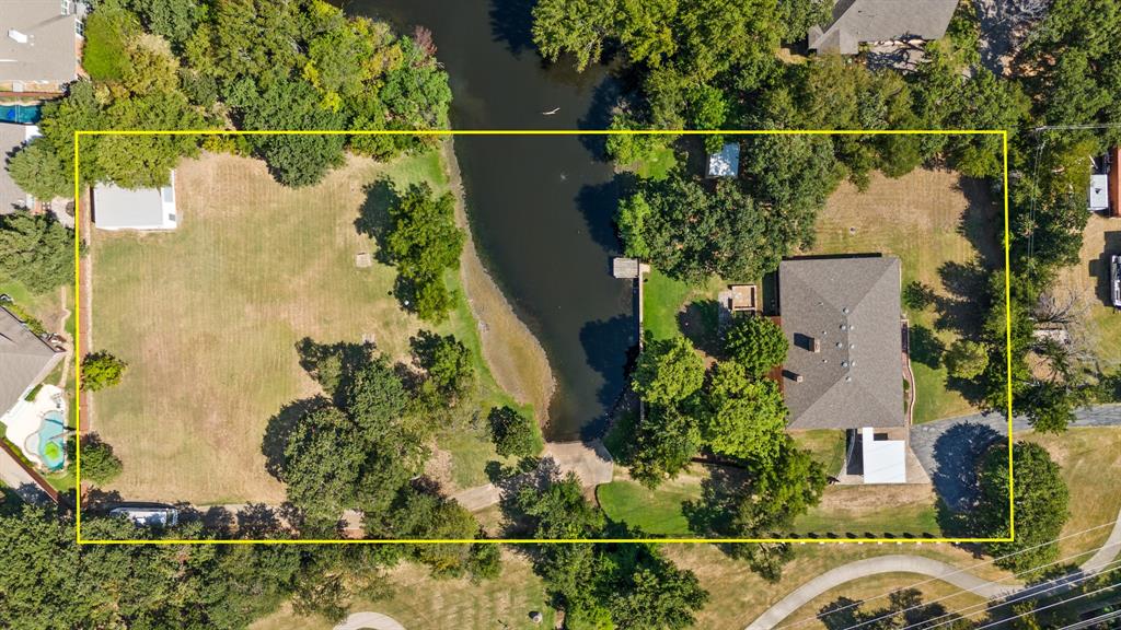 an aerial view of a residential houses with outdoor space