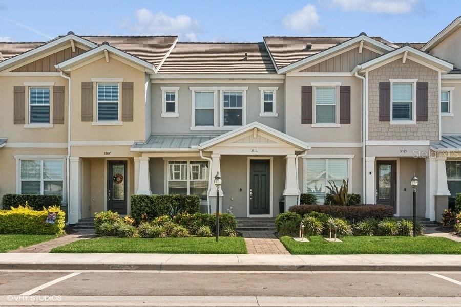 a front view of a house with a yard