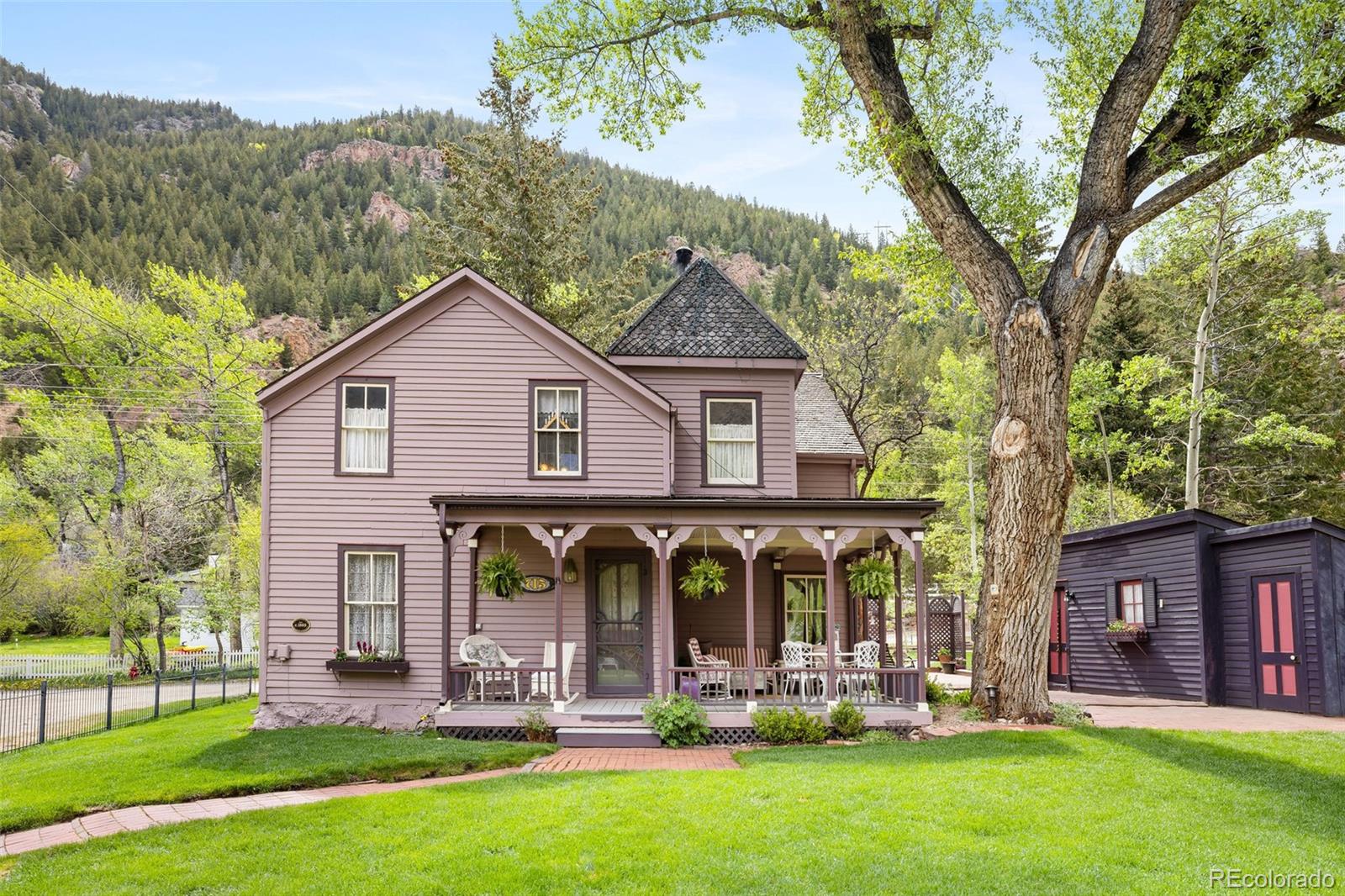 a front view of house with yard and green space