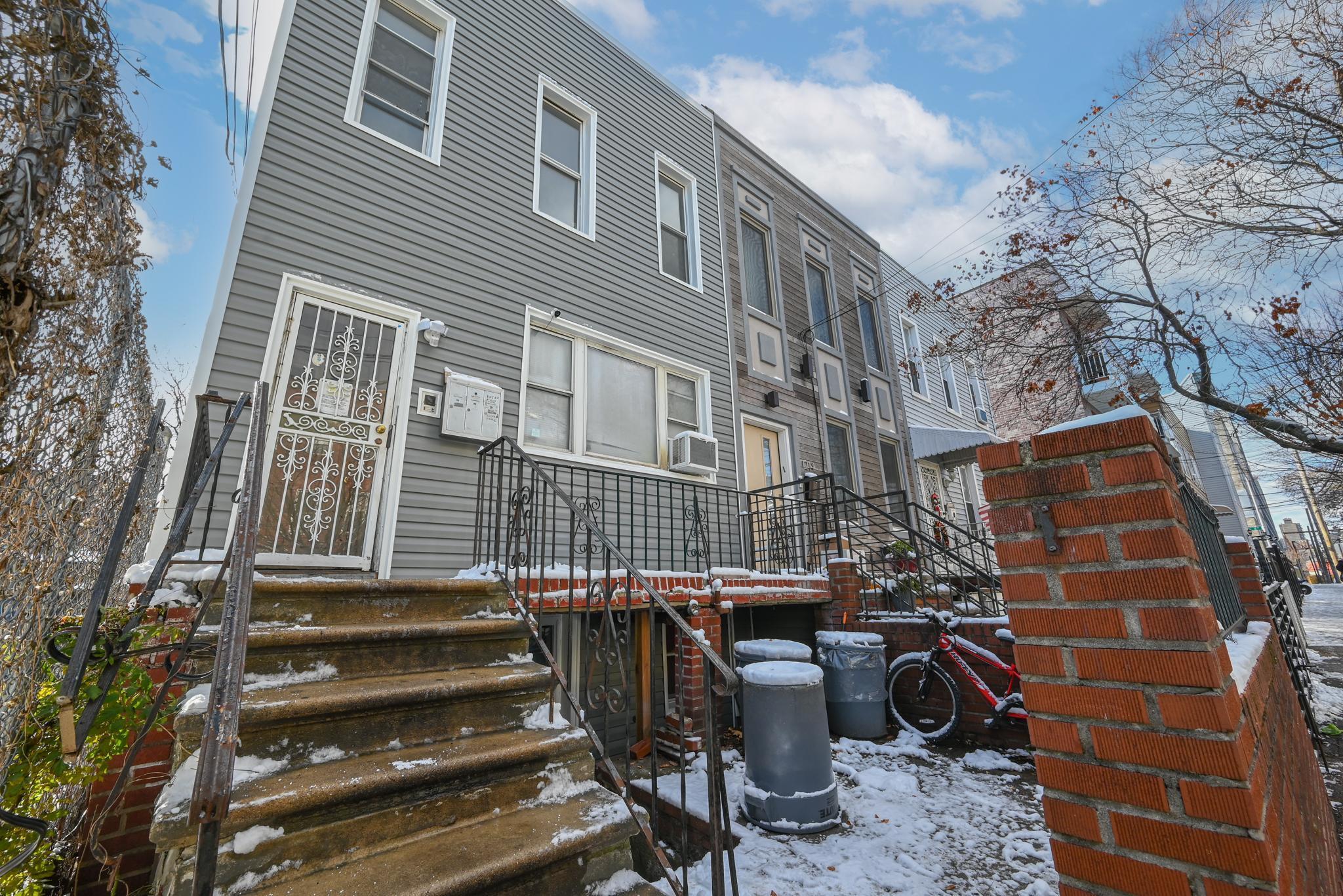 Snow covered house featuring cooling unit