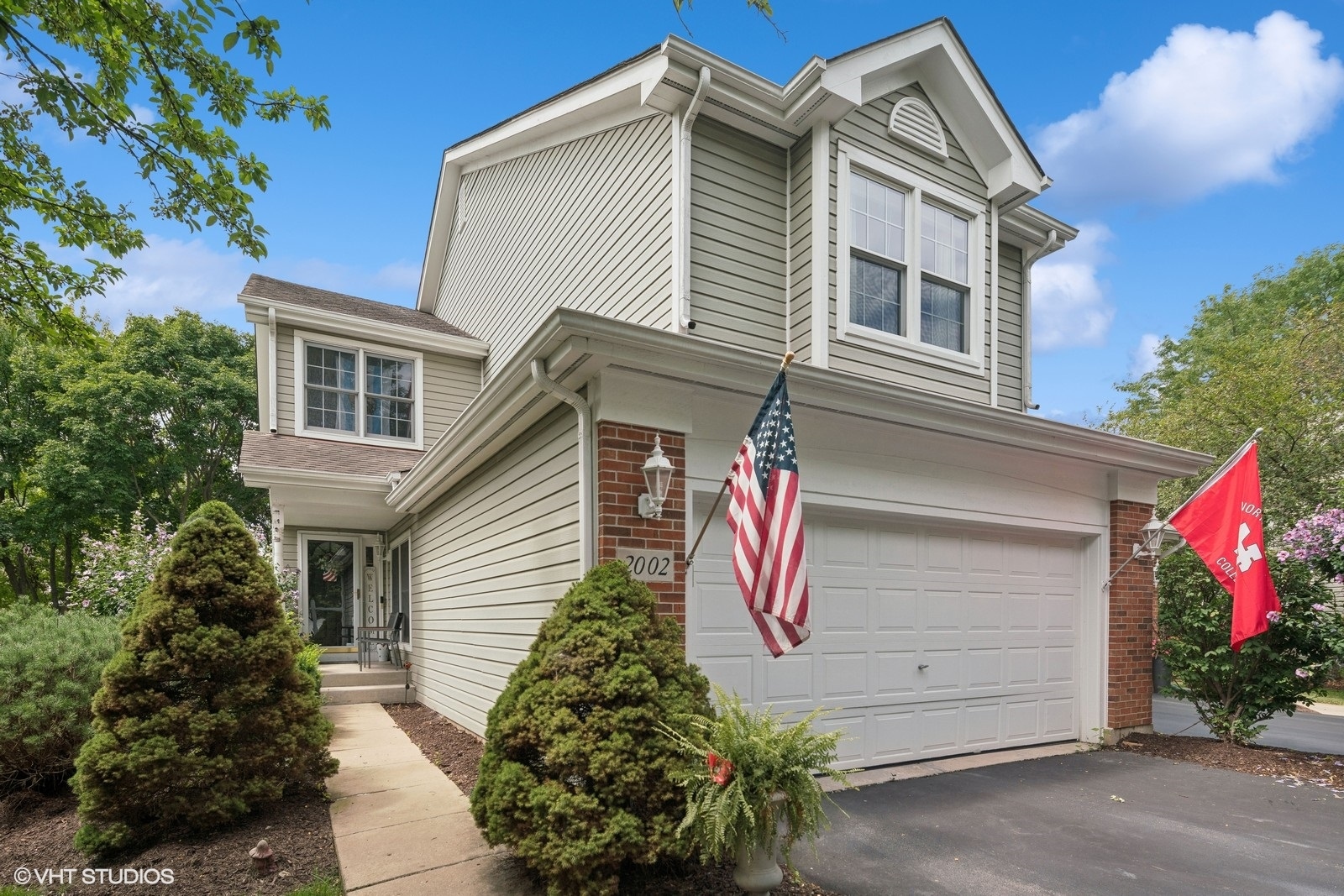 a front view of a house with a garage