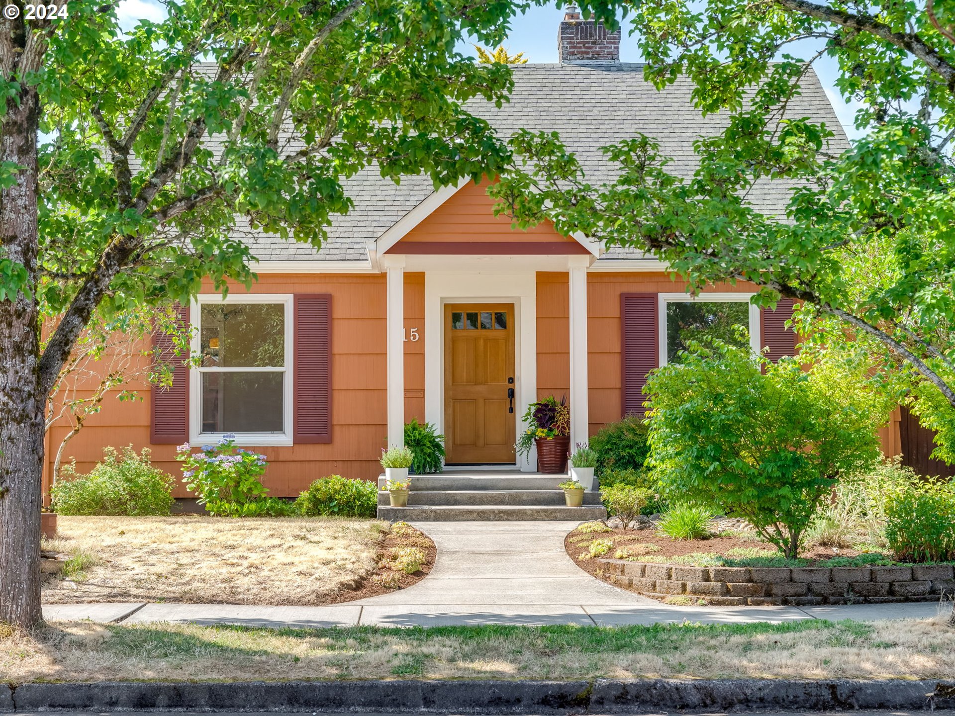 front view of a house with a yard