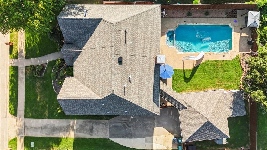 an aerial view of a house with a garden