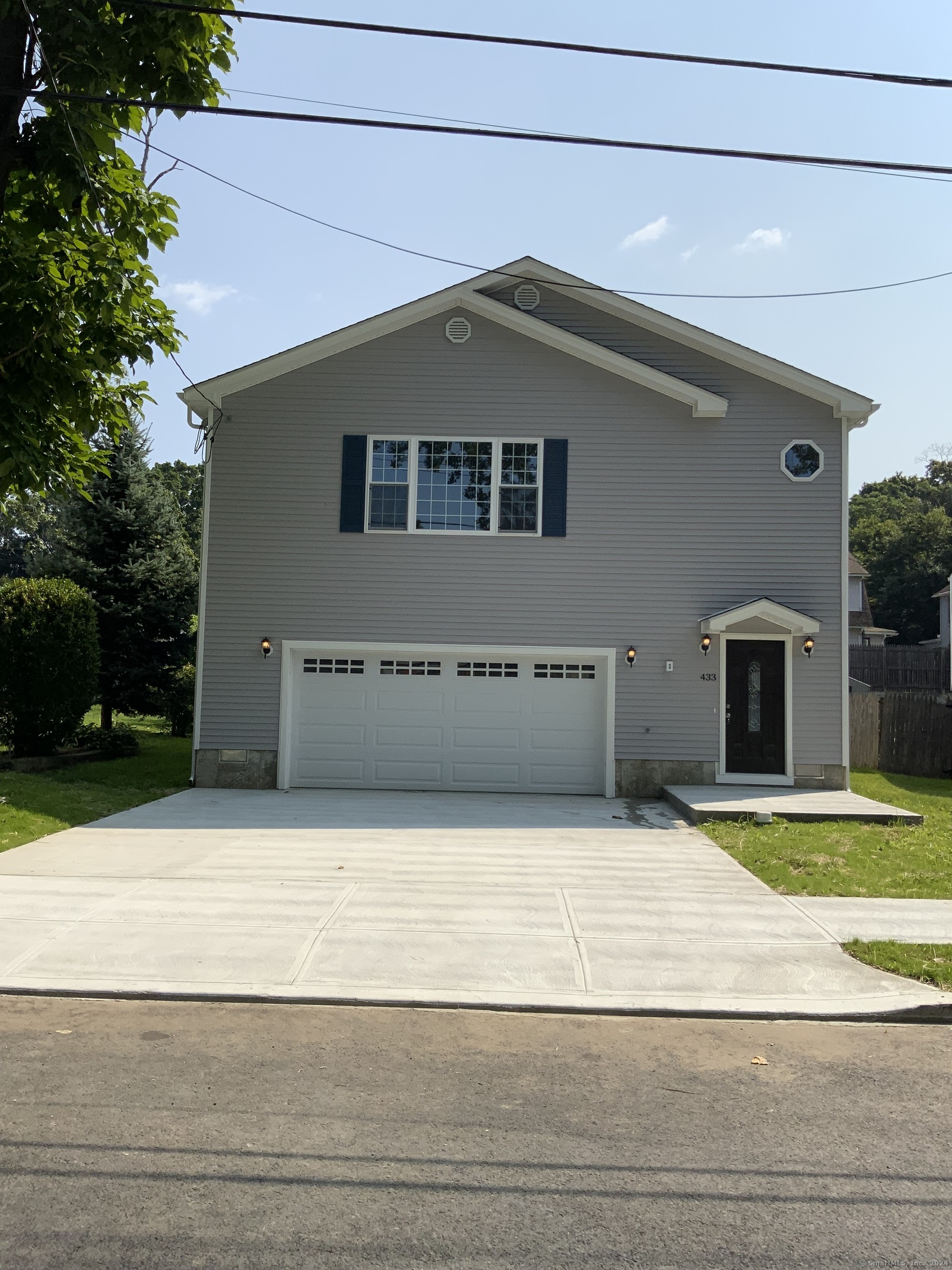 a house that has a swimming pool in front of it