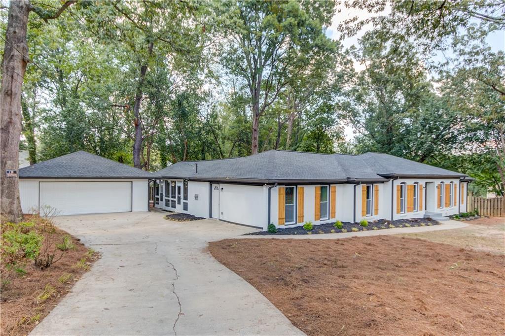 a house with trees in the background