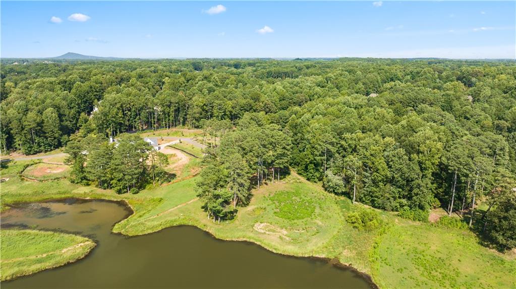 a view of a lake with a yard