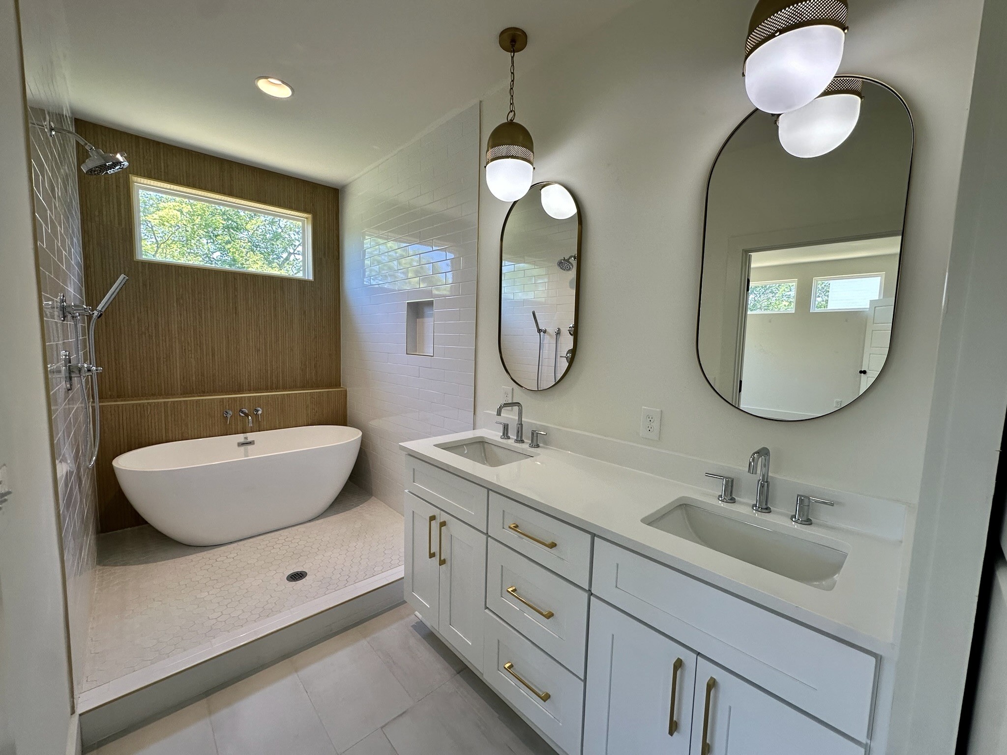 a bathroom with 2 sink and a mirror