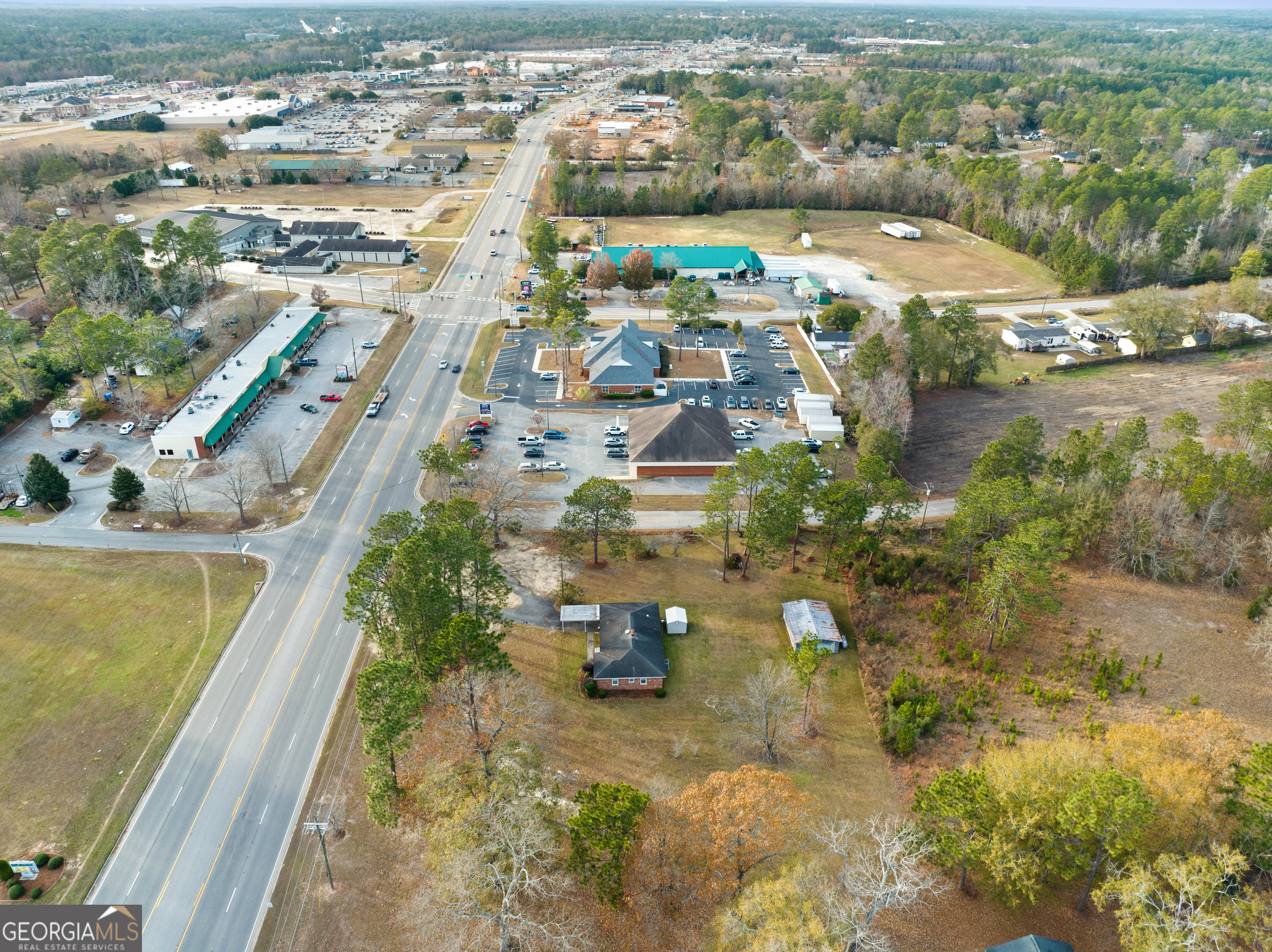 an aerial view of residential houses with outdoor space