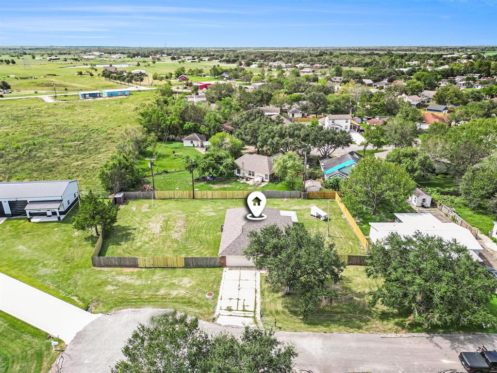 Arial view of the property showcasing the spacious back yard.