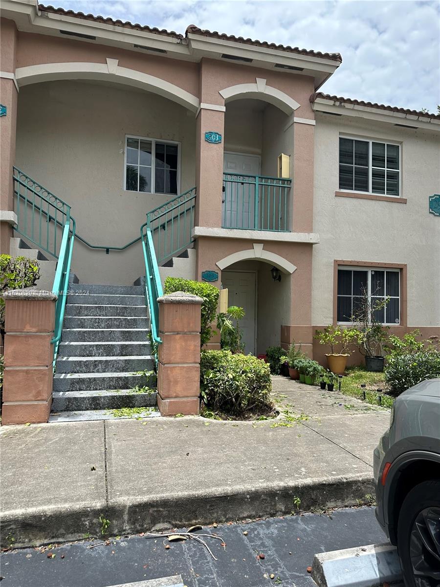 a front view of a house with garage