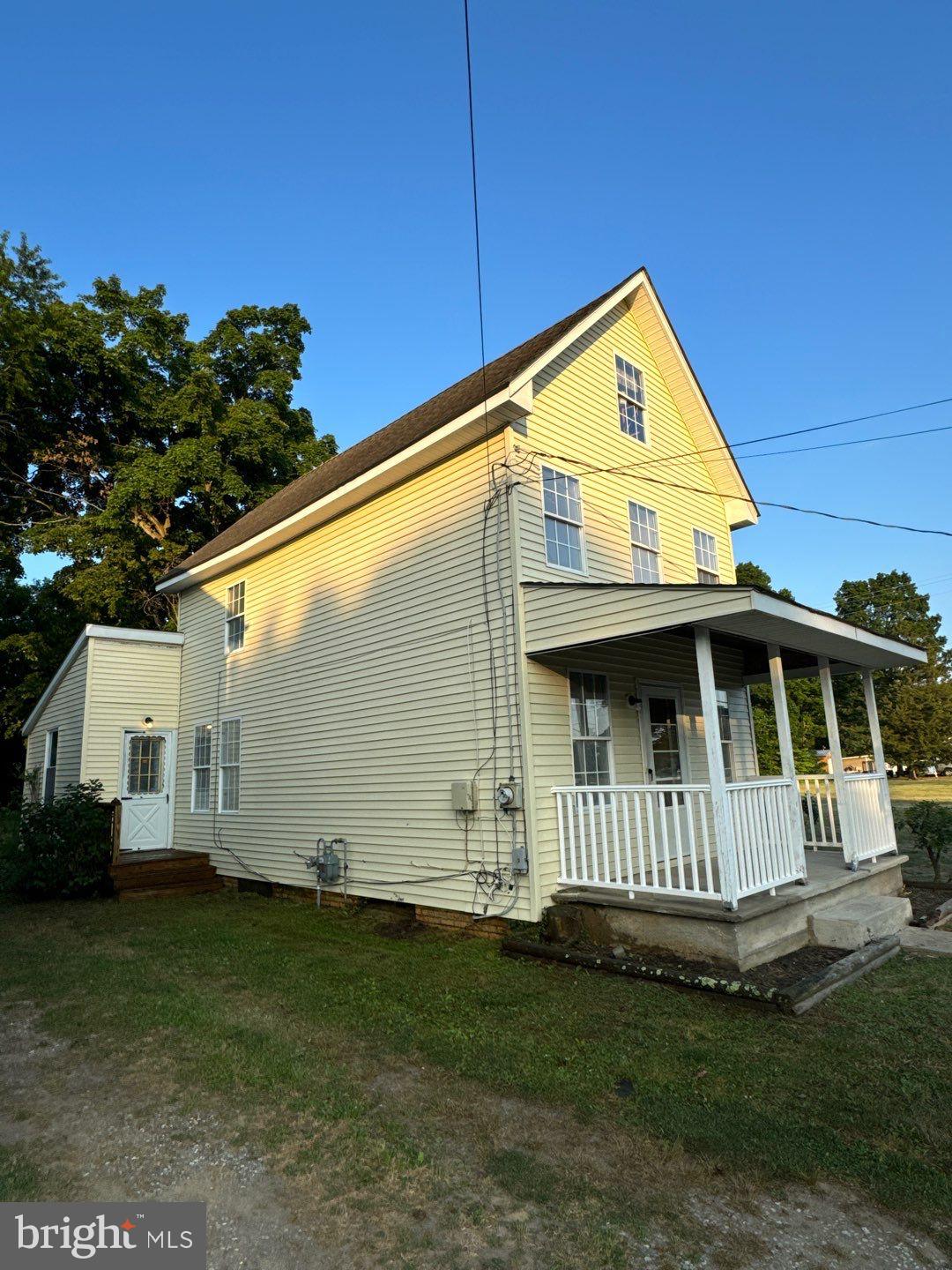 a view of backyard with garden and deck