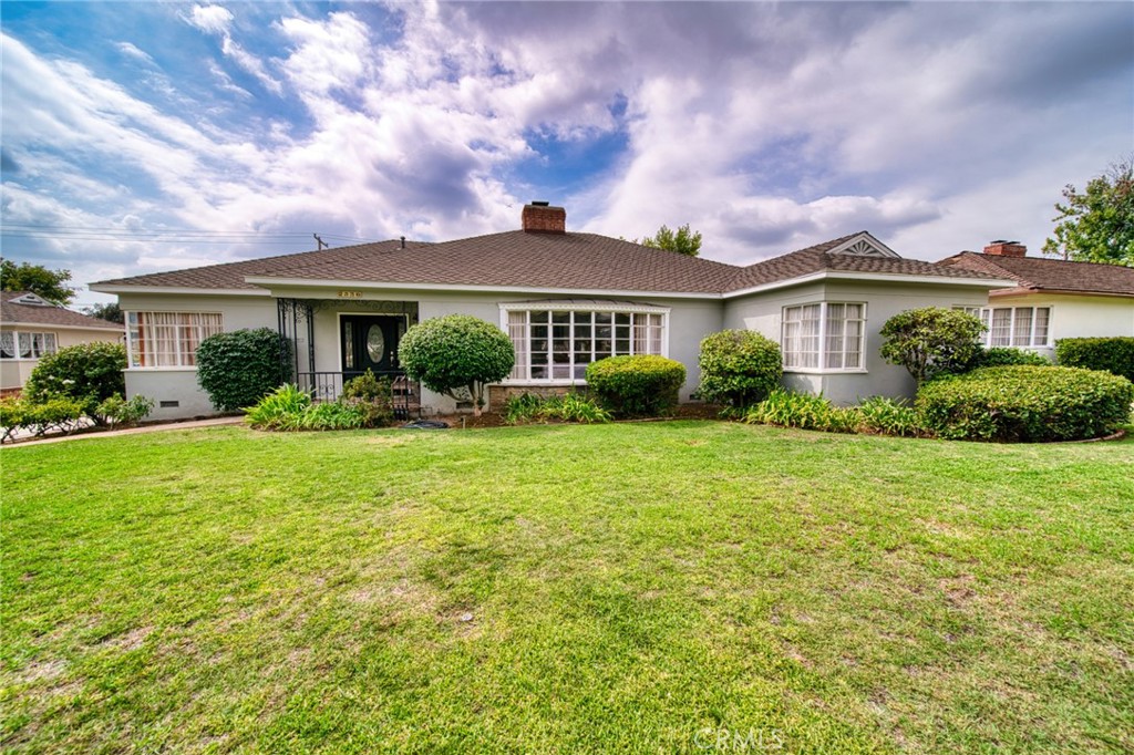 front view of a house with a yard