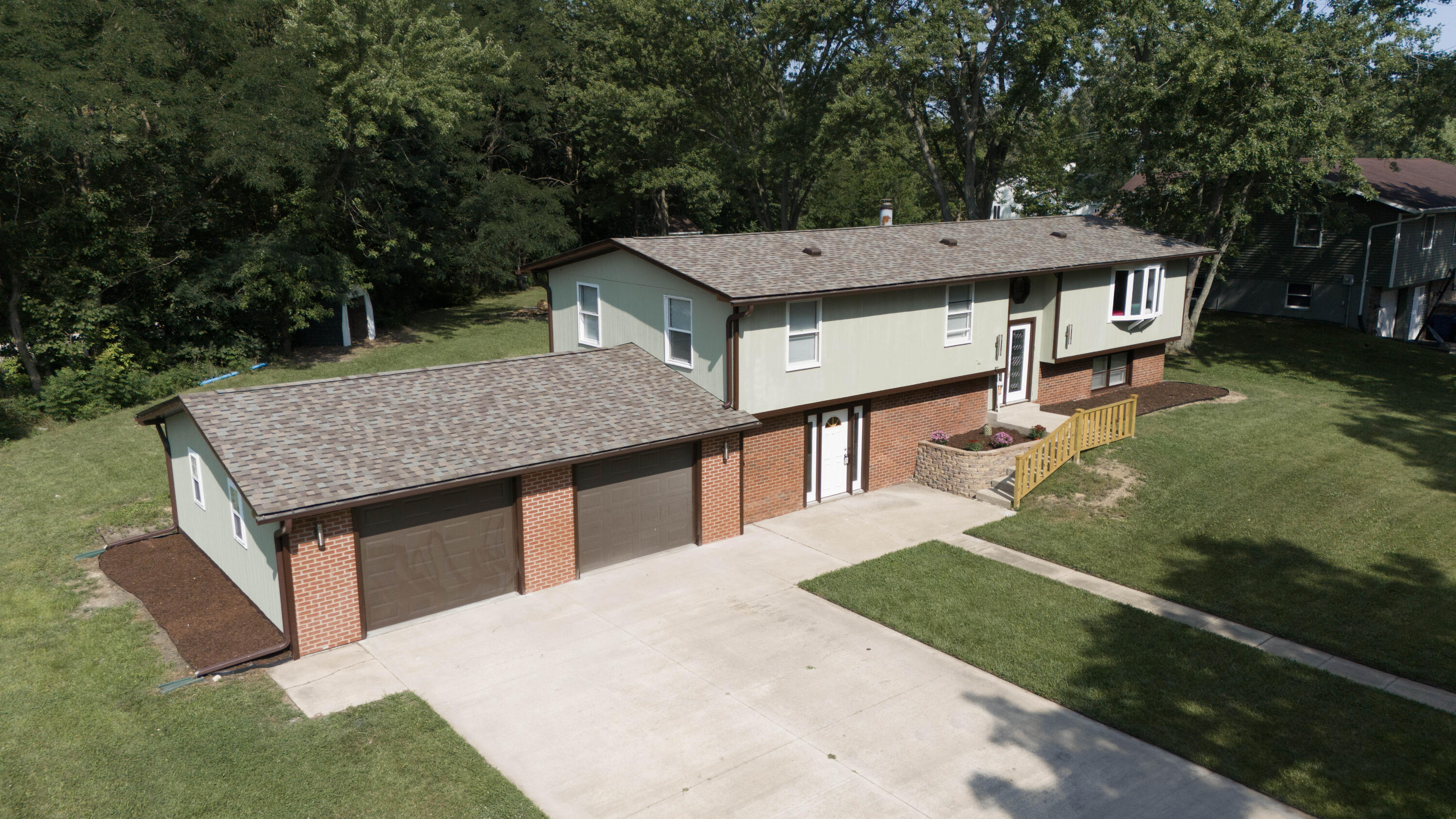 an aerial view of a house having yard