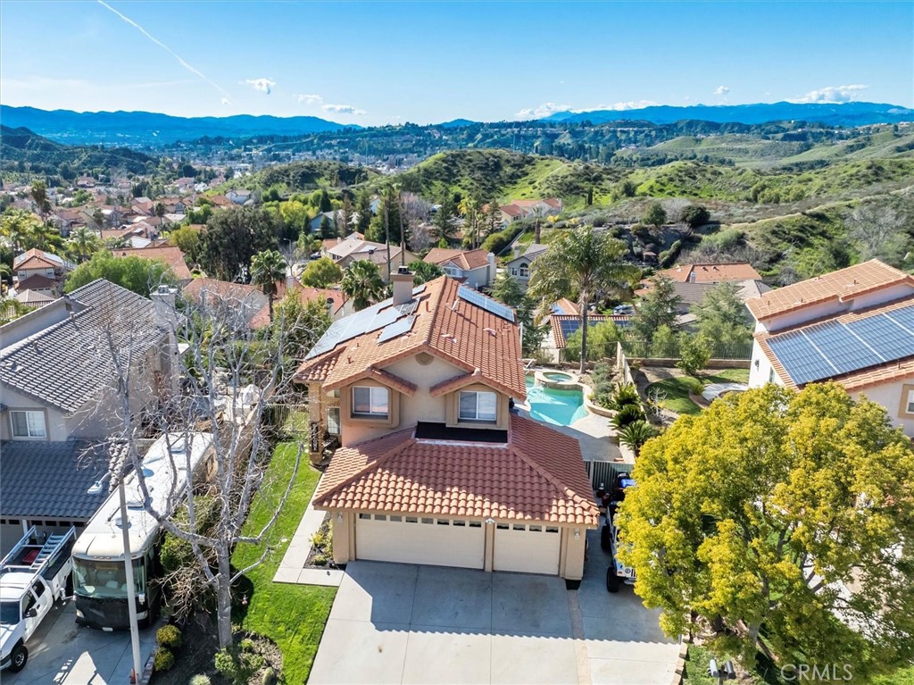 an aerial view of a house with a garden