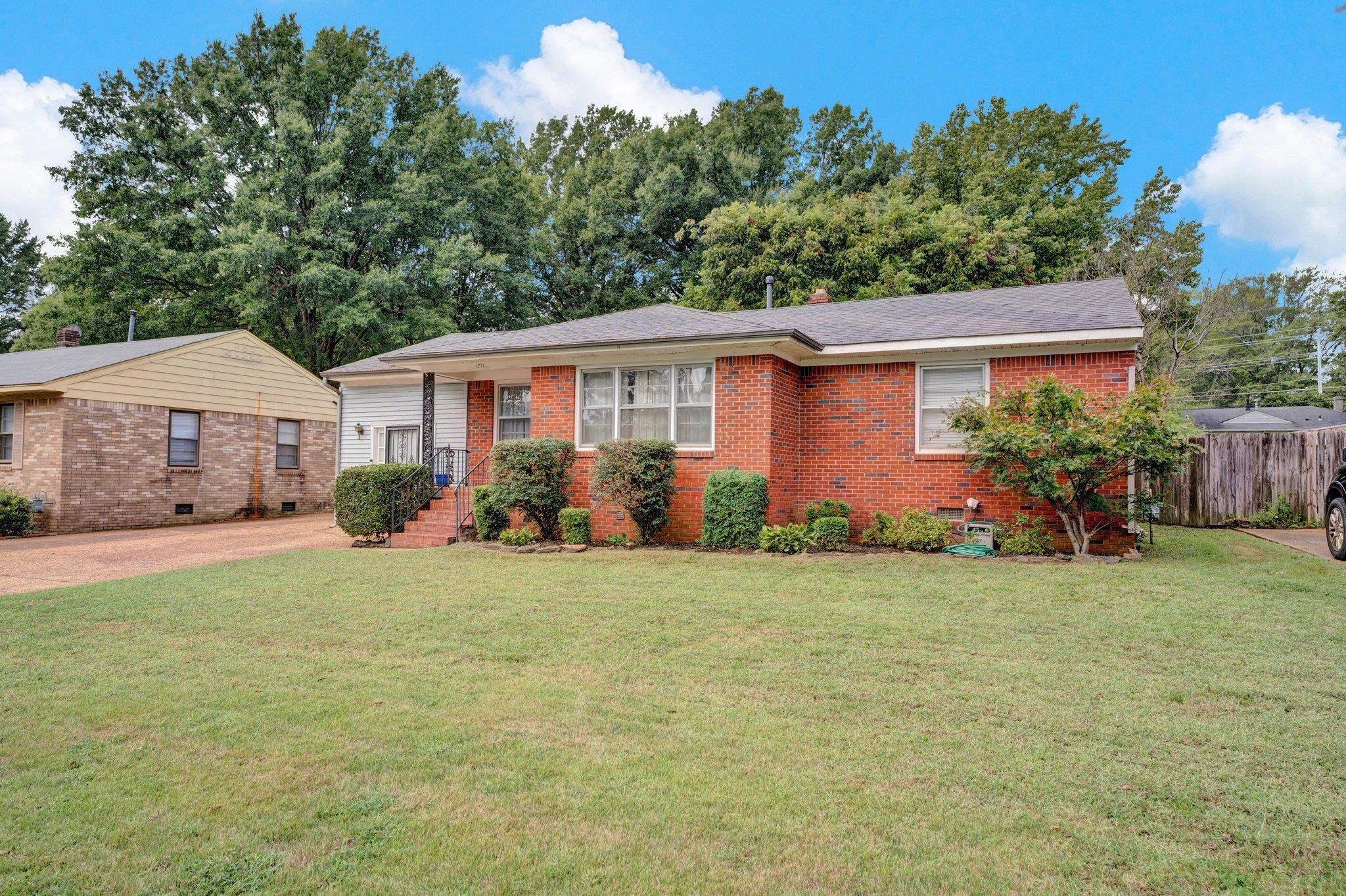 Single story home featuring a front yard