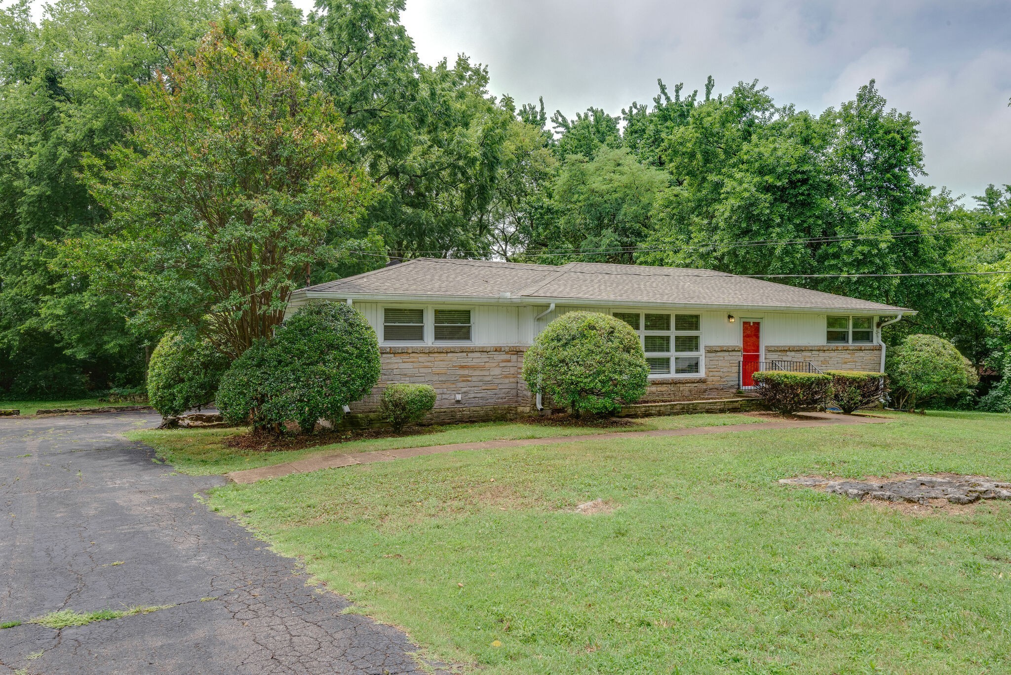 a front view of a house with garden