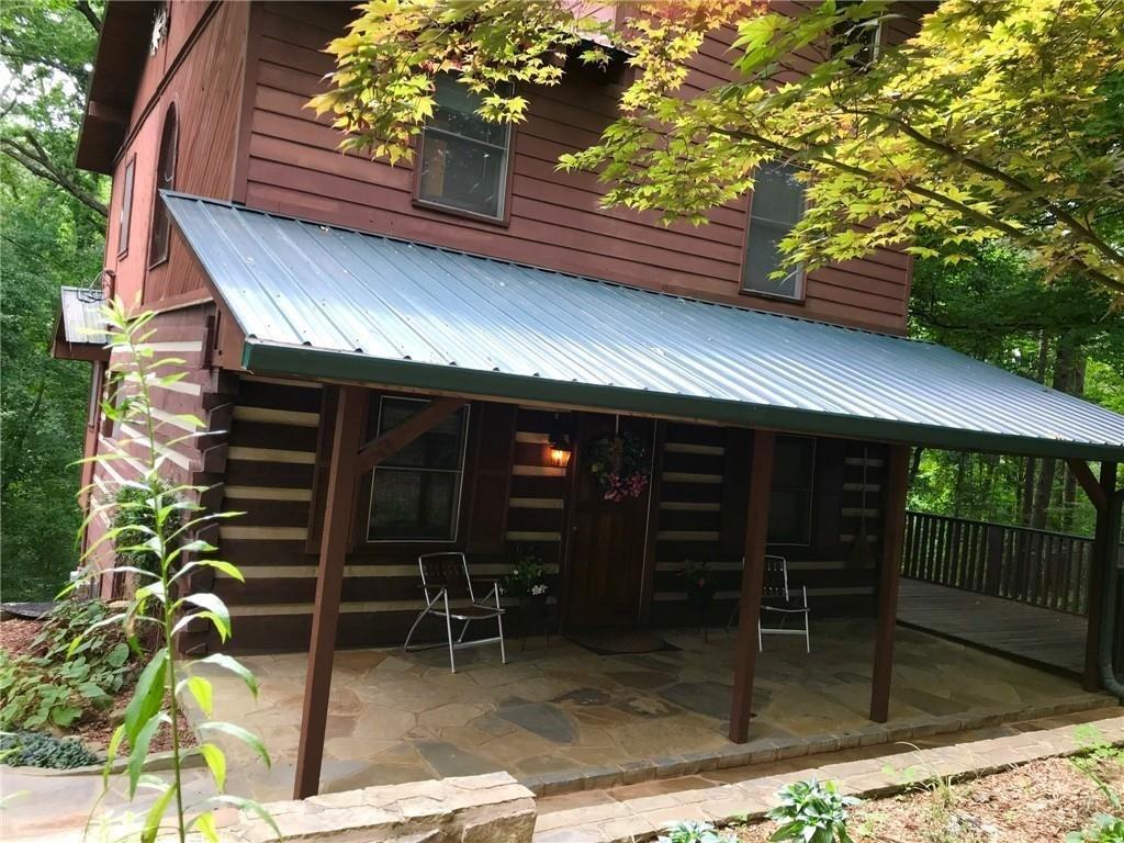 a view of a chairs and table in the patio