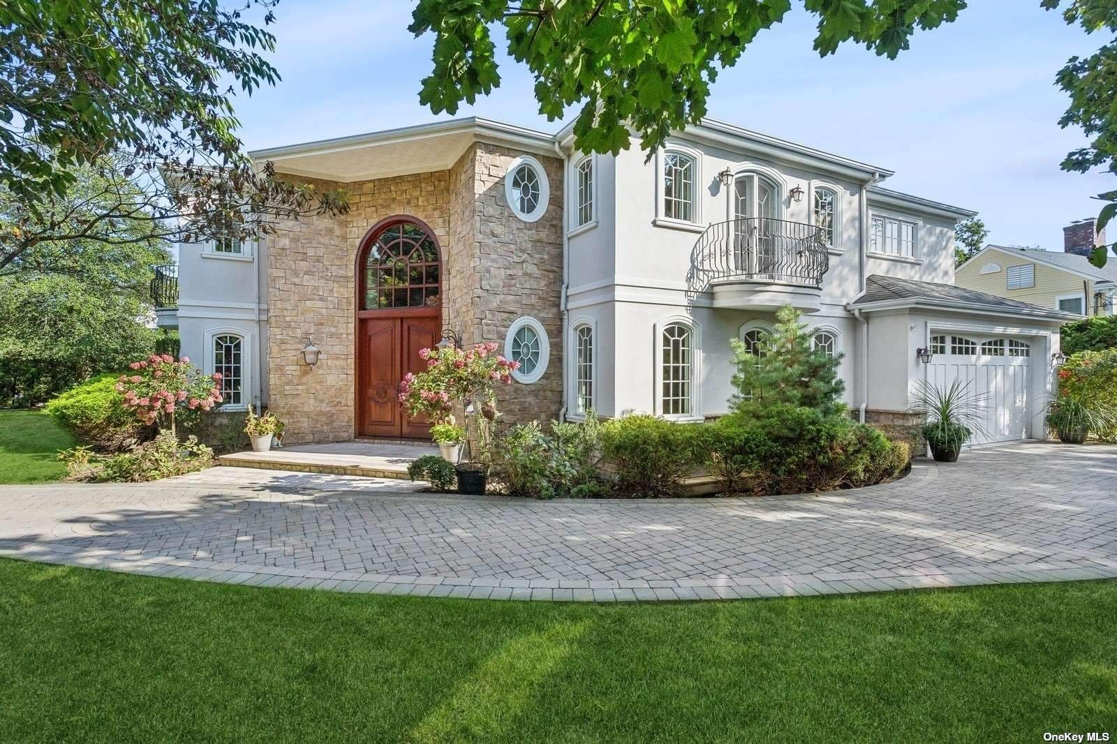 a front view of a house with a garden