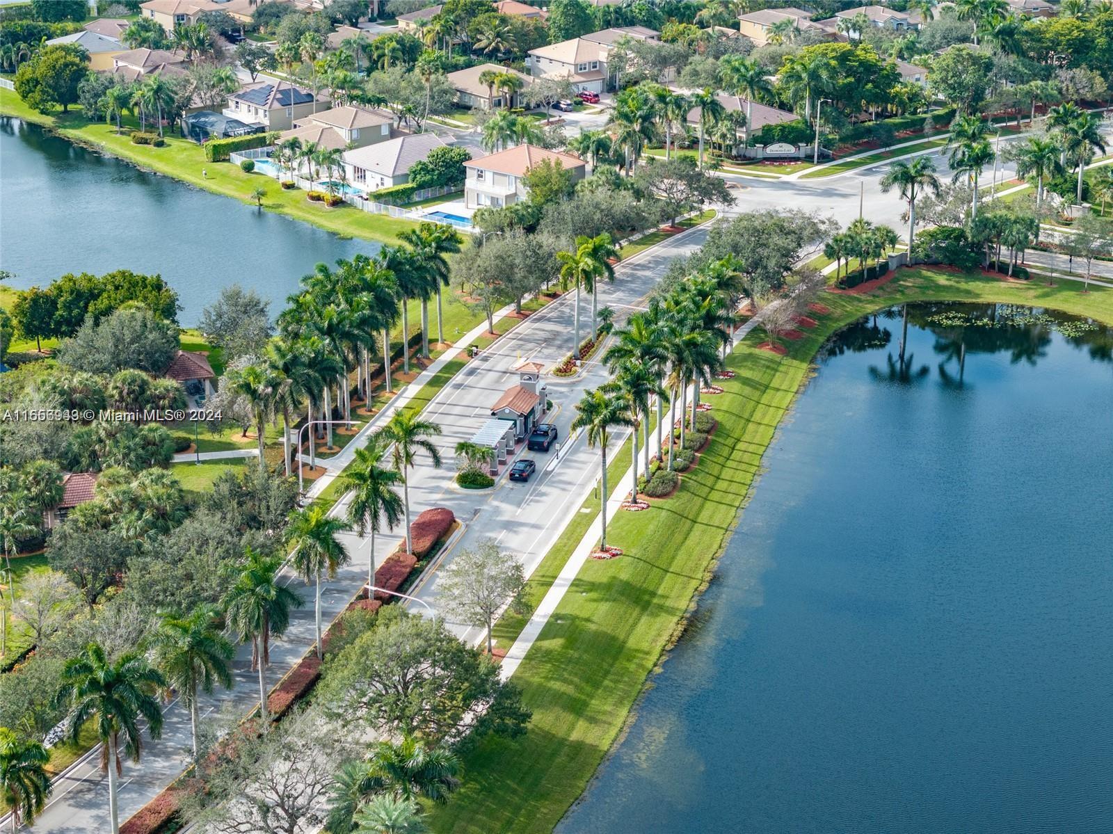 an aerial view of a house with a lake view