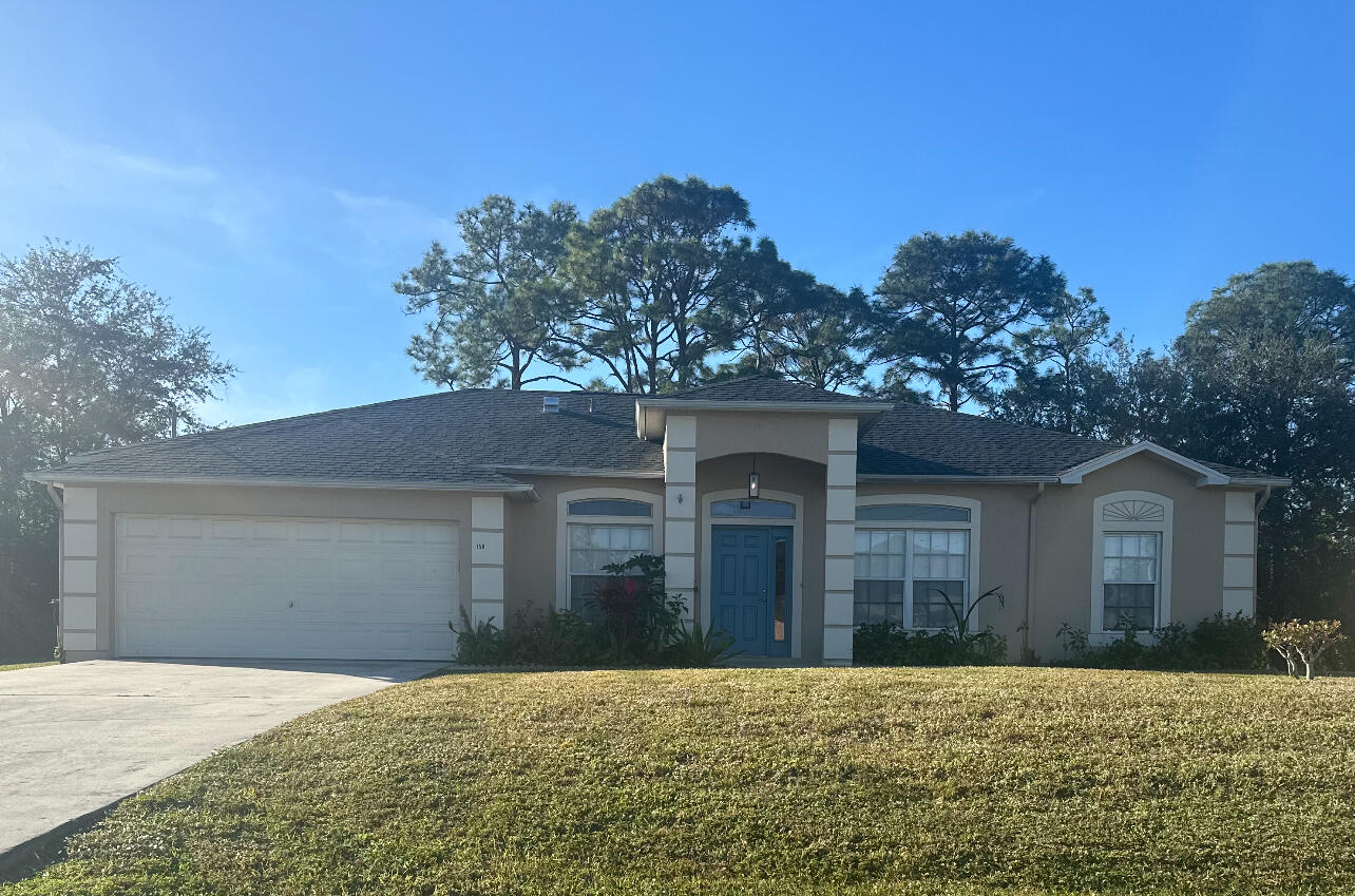 front view of a house with a yard