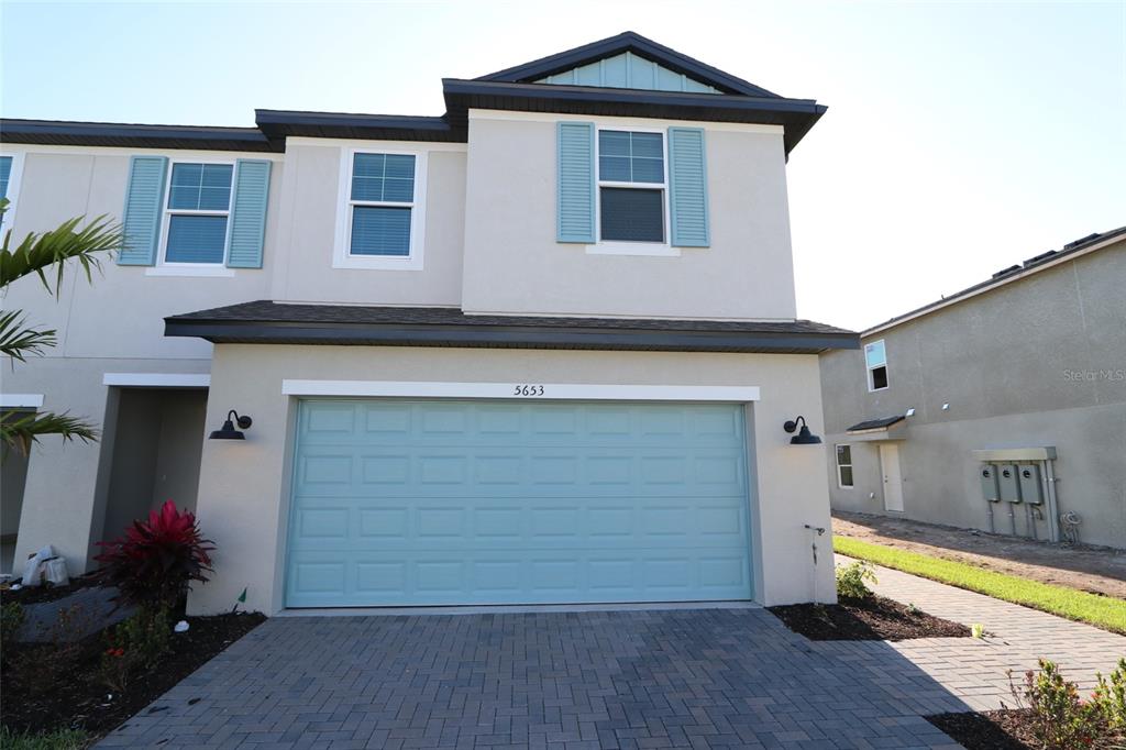 a front view of a house with yard