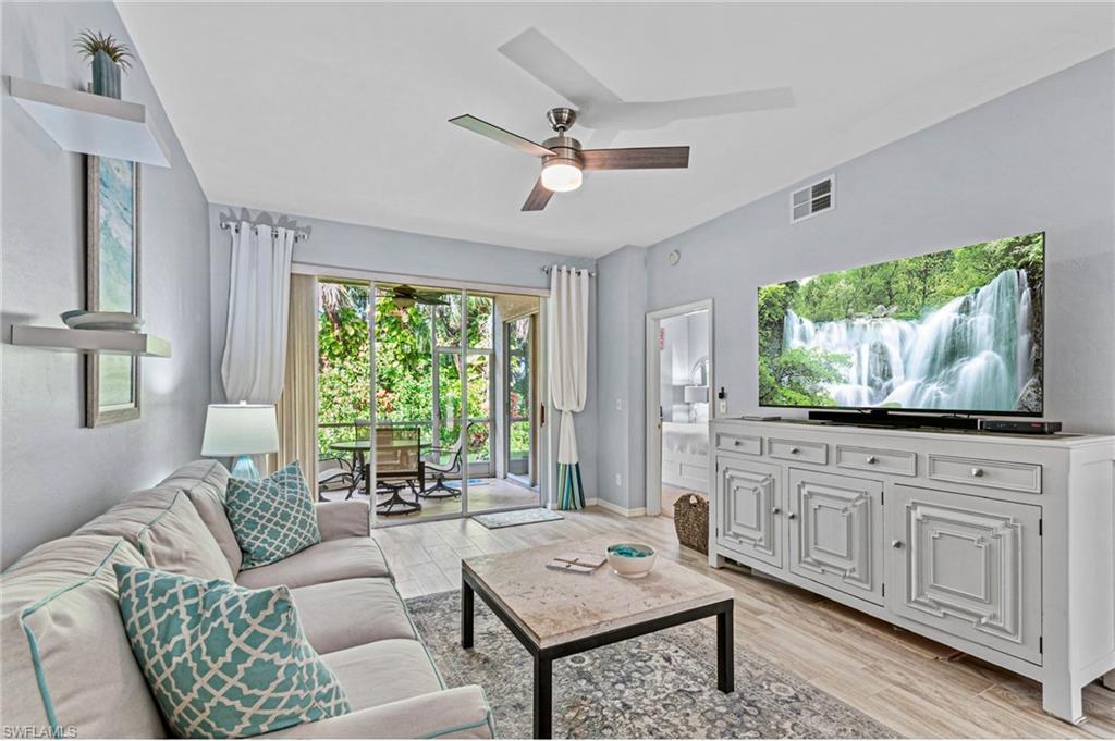 Living room featuring light hardwood / wood-style flooring and ceiling fan