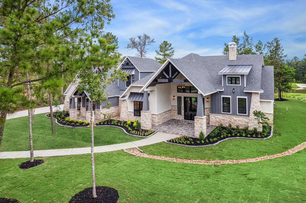 Captivating entrance with an inviting porch and elegant stonework.