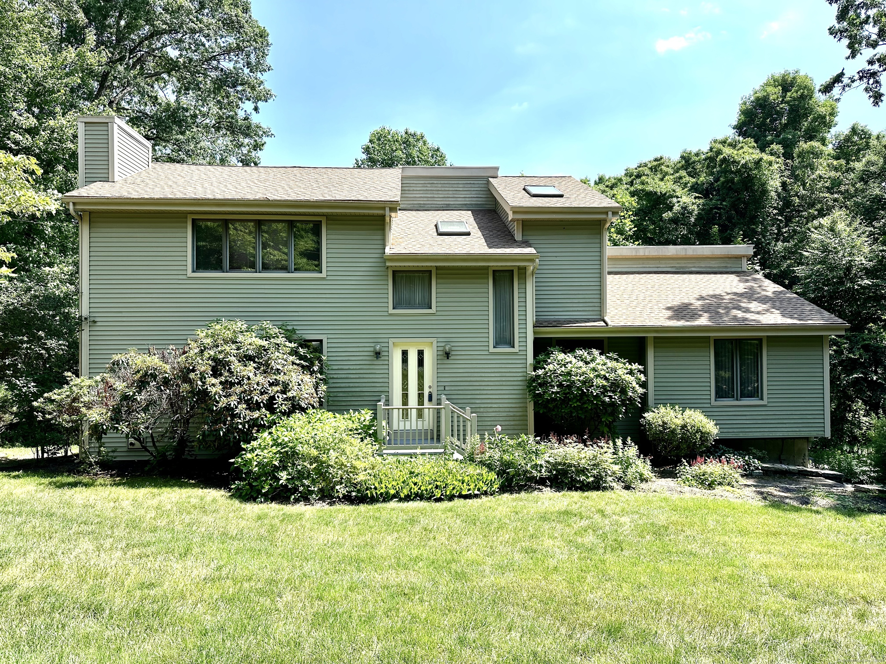 a view of a house with a garden