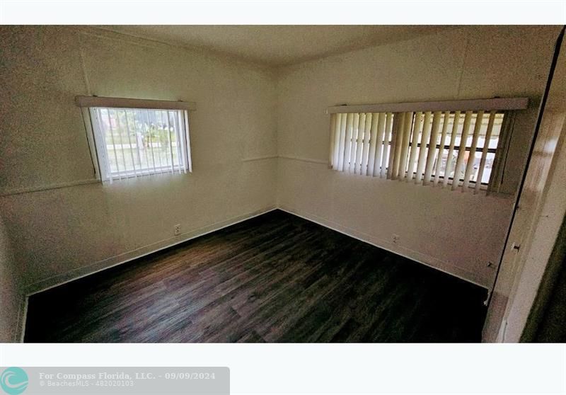 a black and white photo of a living room